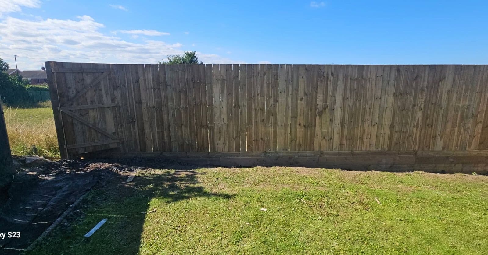 14ft fence and sleeper retaining wall in Boldon, photo 2 of 9
