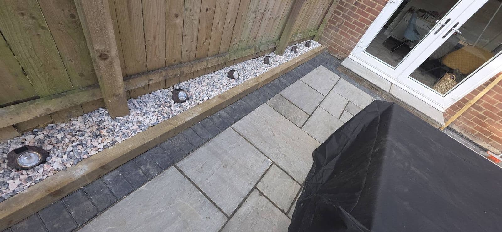 Grey sandstone patio and new fence, photo 2 of 12