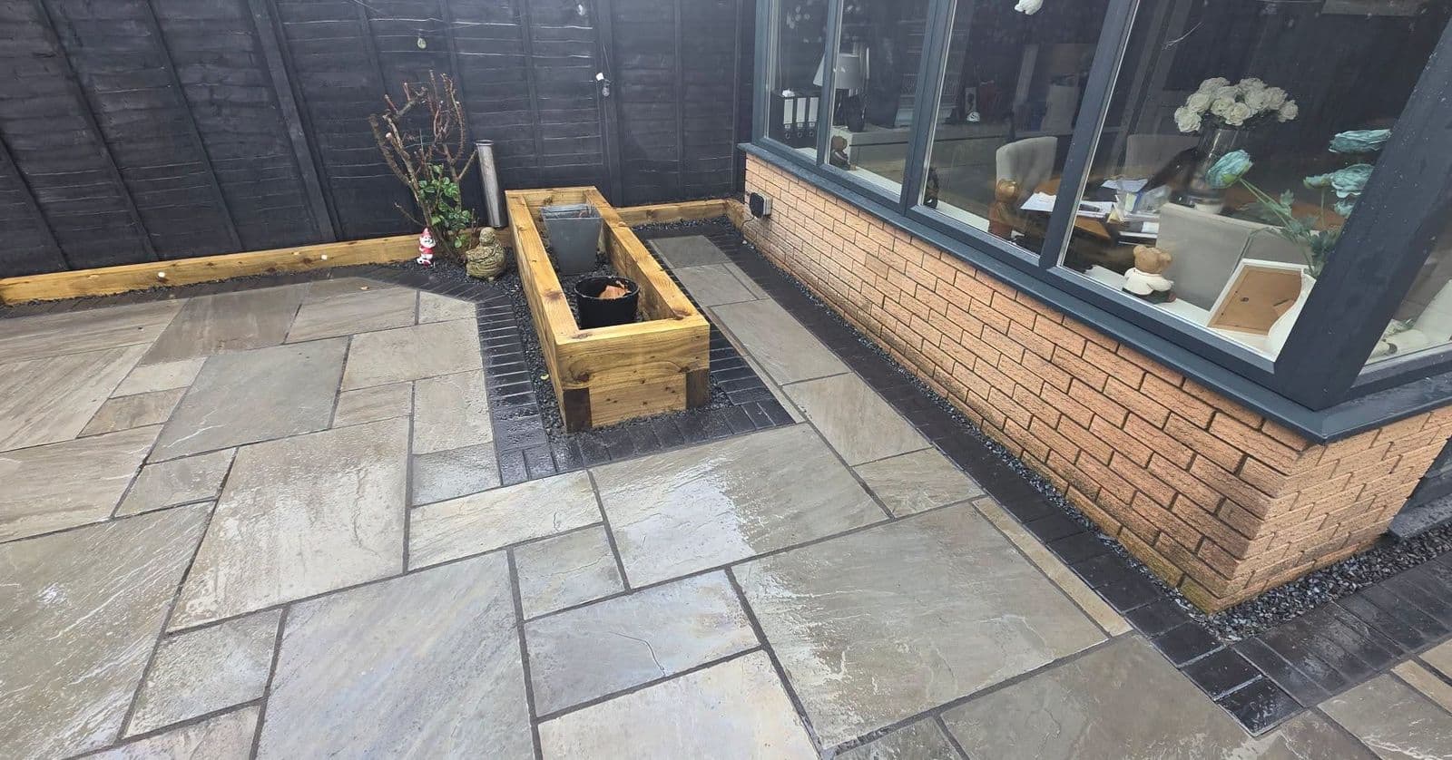 Grey sandstone patio and sleeper planters in Gateshead, photo 4 of 10