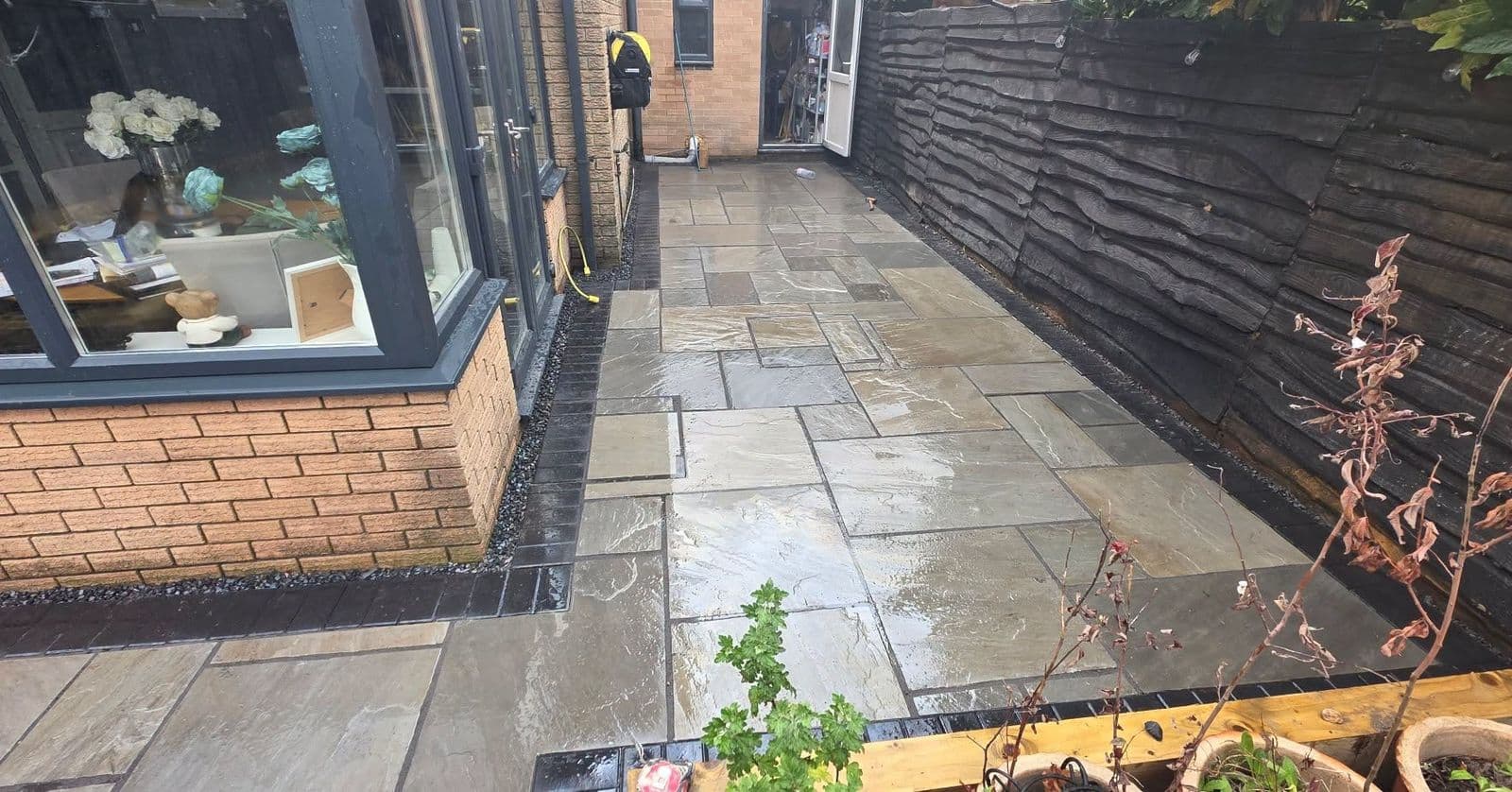 Grey sandstone patio and sleeper planters in Gateshead, photo 5 of 10