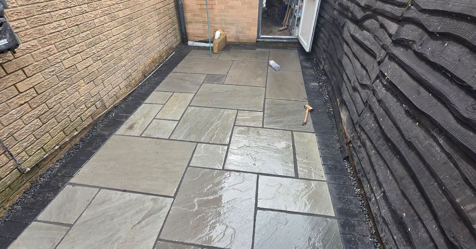 Grey sandstone patio and sleeper planters in Gateshead, photo 6 of 10