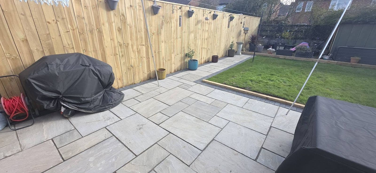 Grey sandstone patio and new fence