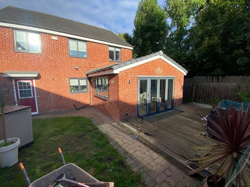 Rotten decking replaced with sandstone and artificial grass in Hebburn, photo 1 of 18