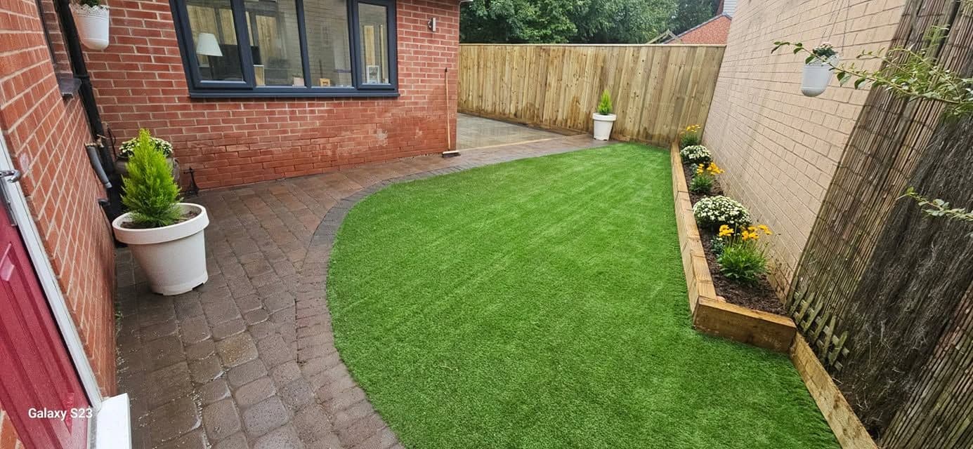 Rotten decking replaced with sandstone and artificial grass in Hebburn, photo 10 of 18