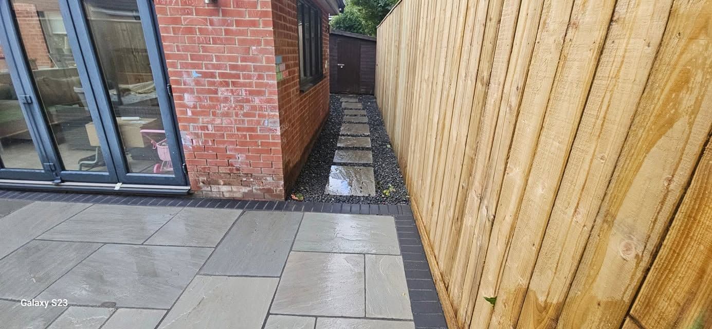 Rotten decking replaced with sandstone and artificial grass in Hebburn, photo 13 of 18