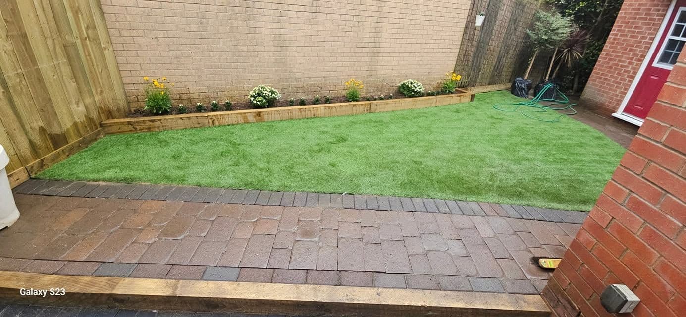 Rotten decking replaced with sandstone and artificial grass in Hebburn, photo 16 of 18