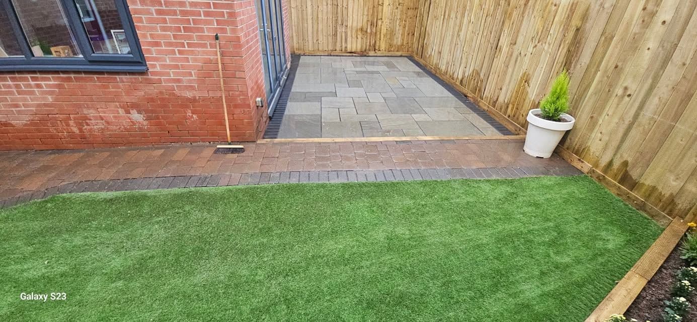 Rotten decking replaced with sandstone and artificial grass in Hebburn