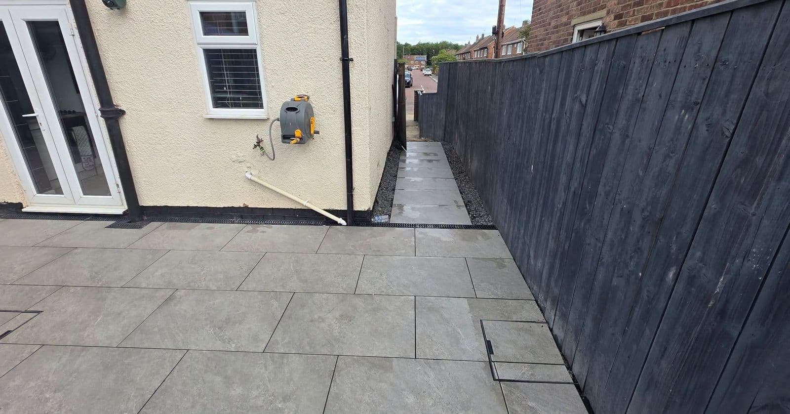 Grey porcelain patio with drainage in Hebburn, photo 1 of 10