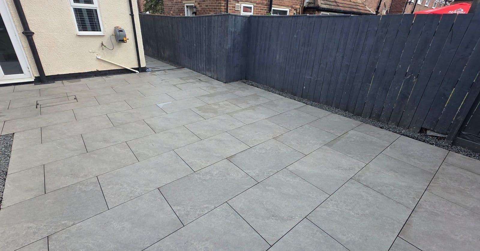 Grey porcelain patio with drainage in Hebburn