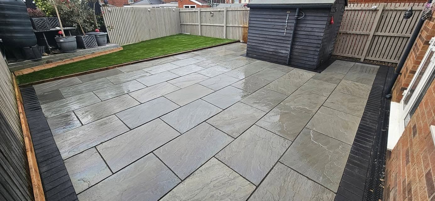 Grey sandstone patio and artificial grass in Jarrow, photo 1 of 27
