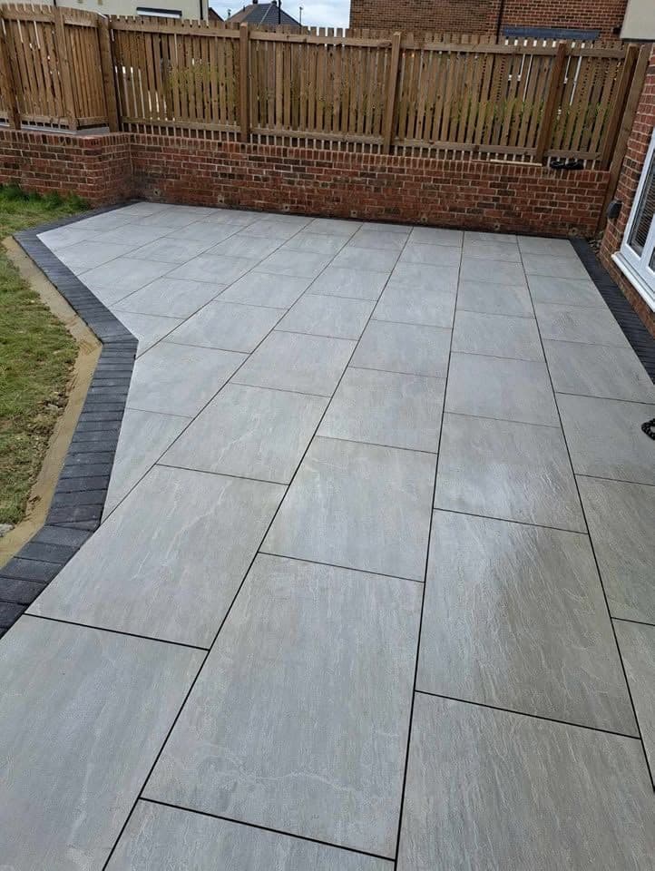 Porcelain patio with charcoal border in Jarrow (Lakes Estate), photo 1 of 16