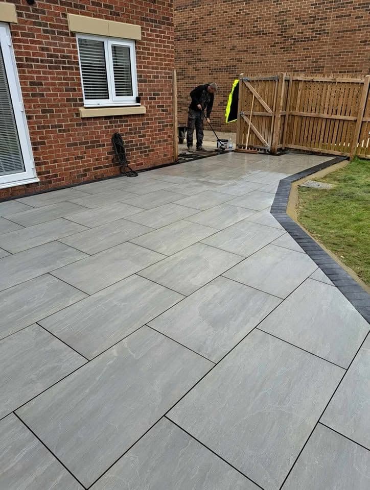 Porcelain patio with charcoal border in Jarrow (Lakes Estate), photo 3 of 16