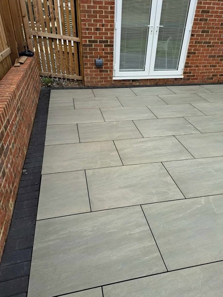 Porcelain patio with charcoal border in Jarrow (Lakes Estate), photo 5 of 16