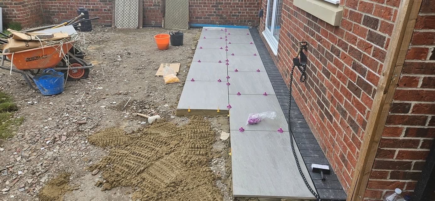 Porcelain patio with charcoal border in Jarrow (Lakes Estate), photo 11 of 16