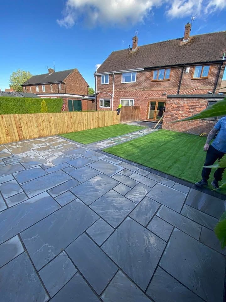 Indian sandstone patio and two artificial lawns in Wardley, photo 1 of 22