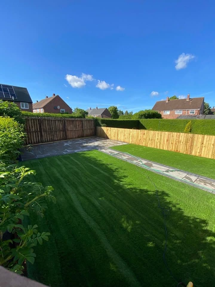 Indian sandstone patio and two artificial lawns in Wardley, photo 2 of 22