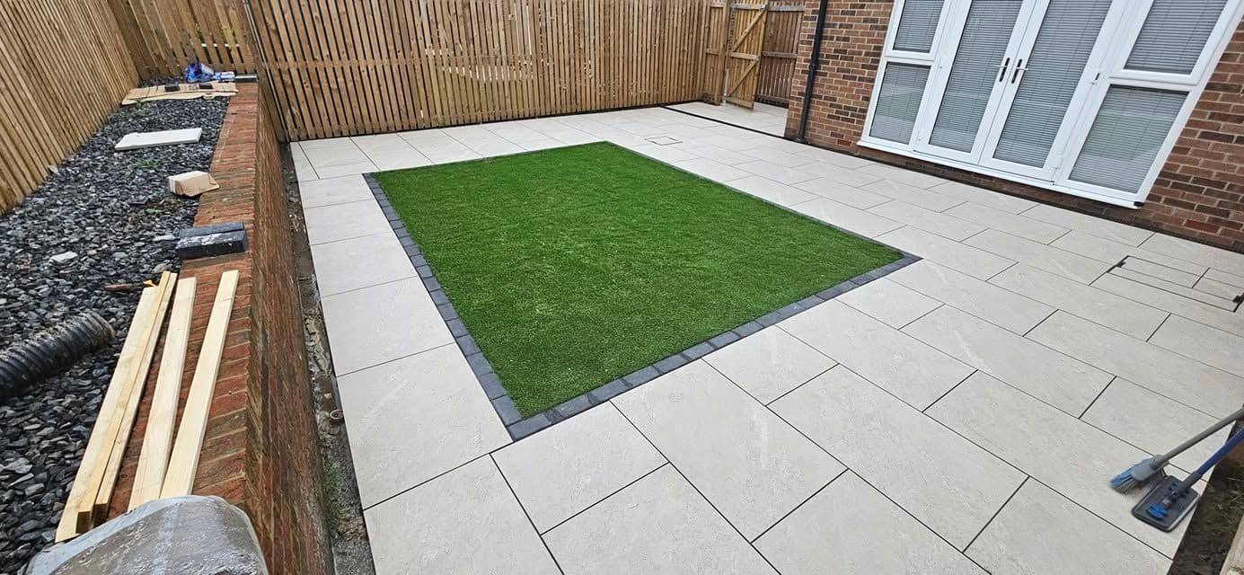 White porcelain patio framing an artificial lawn, photo 3 of 21