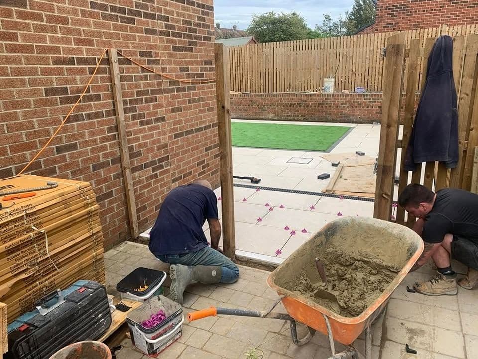 White porcelain patio framing an artificial lawn, photo 6 of 21