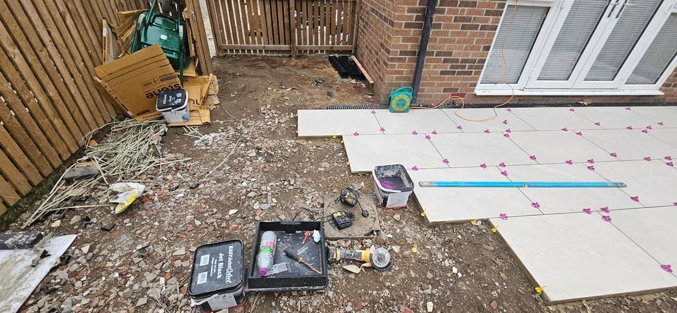 White porcelain patio framing an artificial lawn, photo 9 of 21