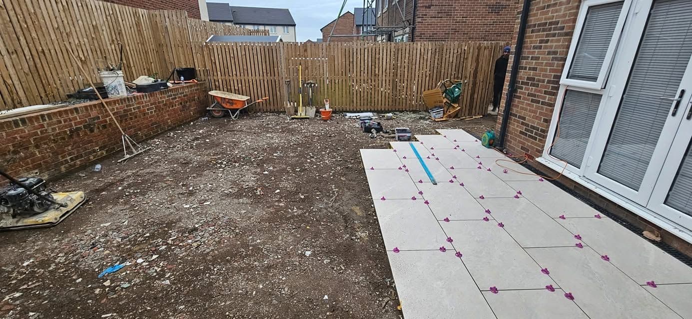 White porcelain patio framing an artificial lawn, photo 11 of 21