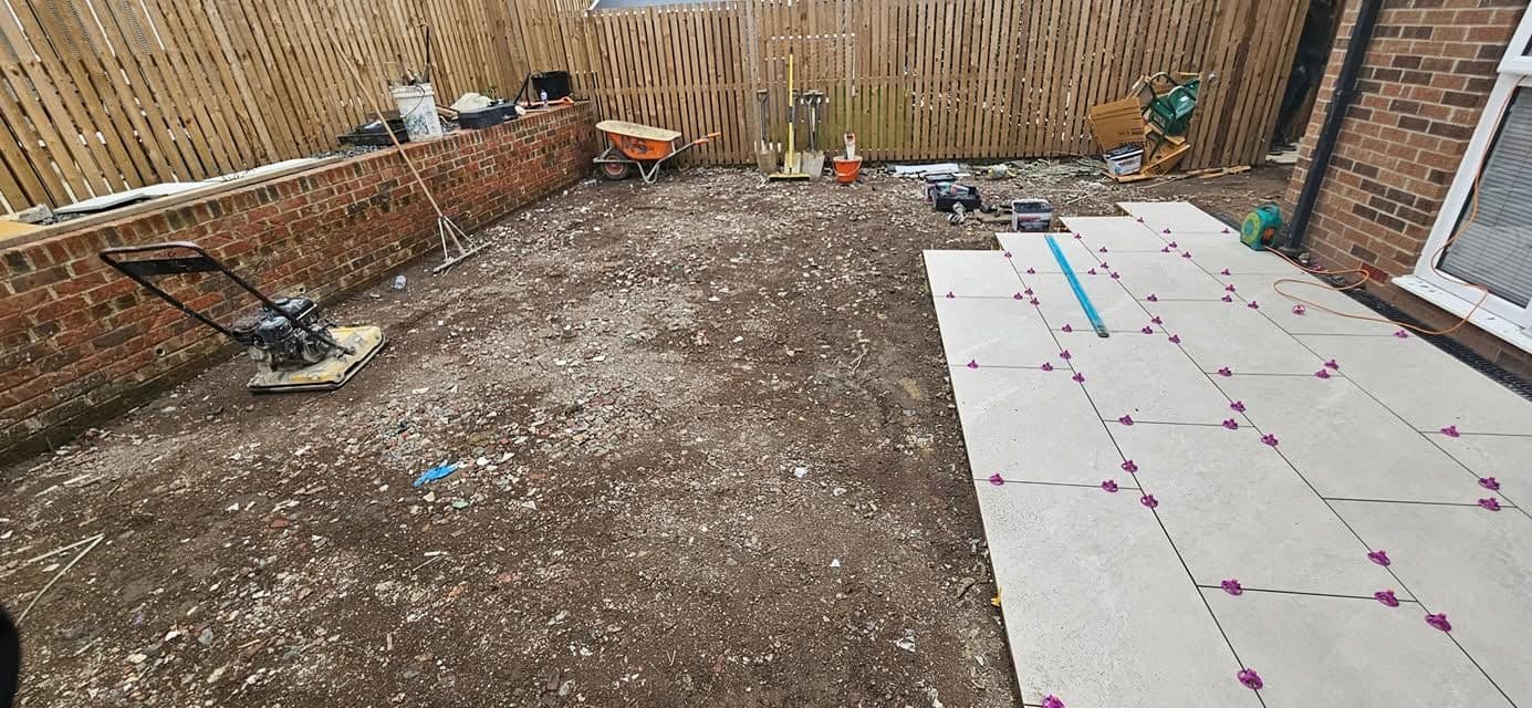 White porcelain patio framing an artificial lawn, photo 12 of 21