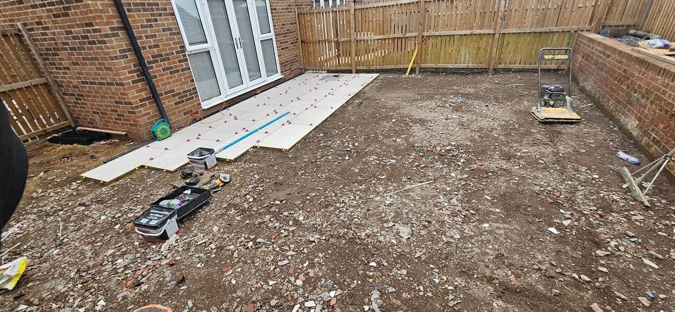 White porcelain patio framing an artificial lawn, photo 13 of 21