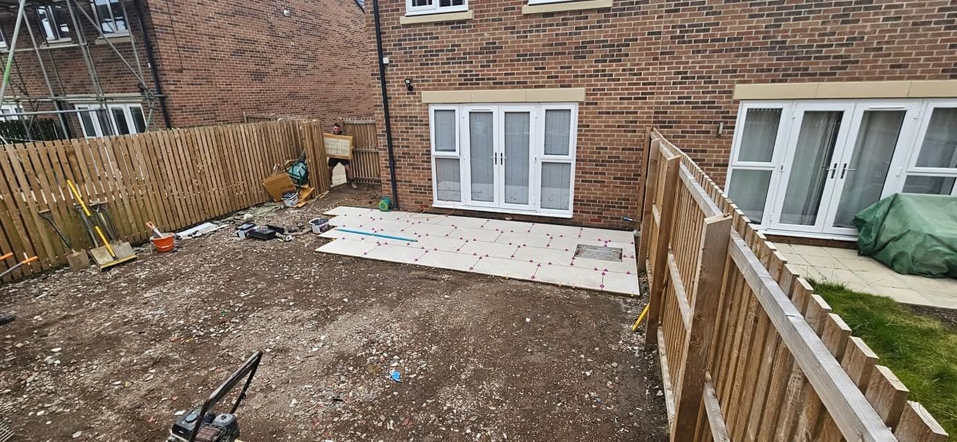 White porcelain patio framing an artificial lawn, photo 15 of 21